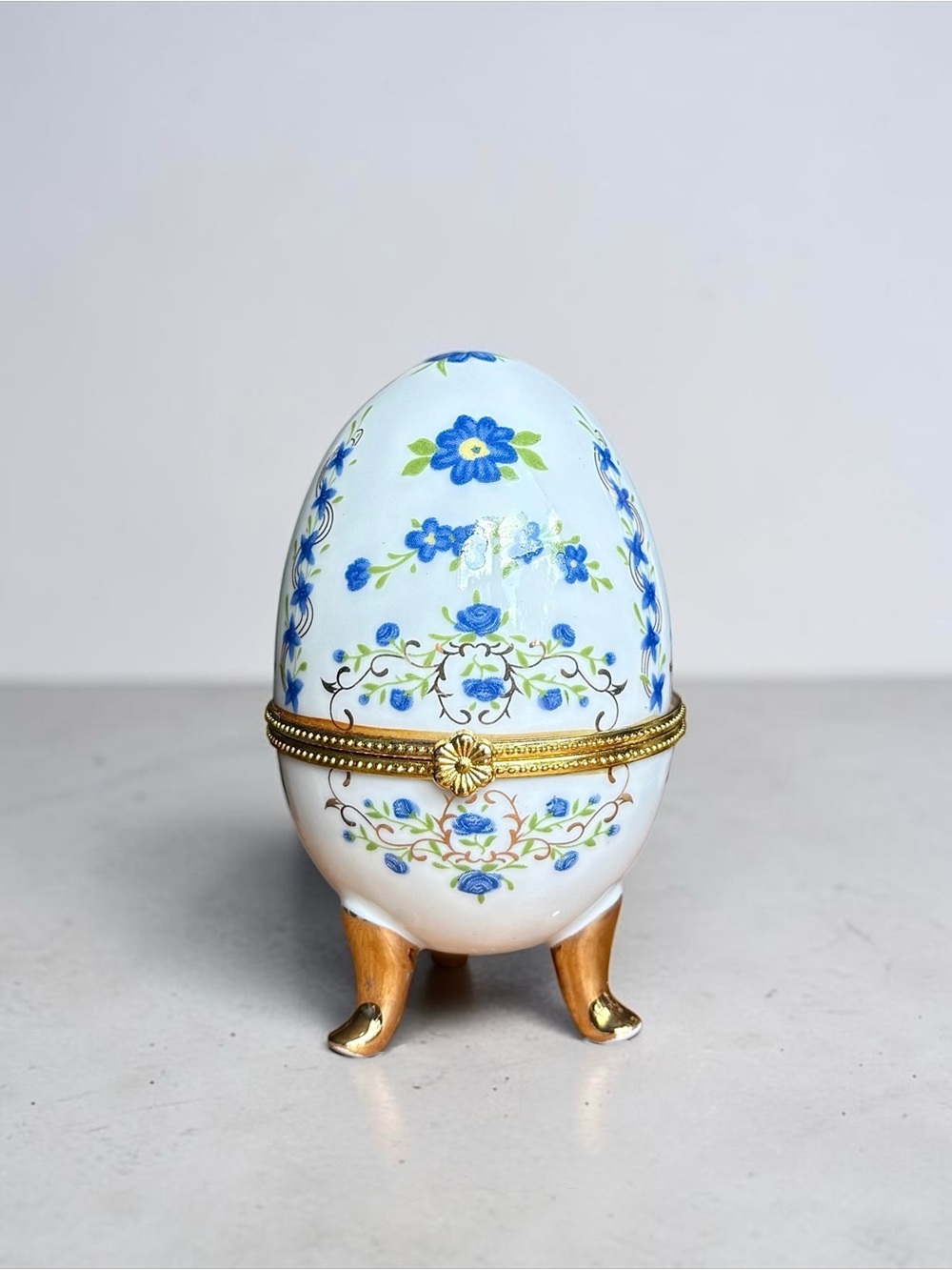 Vintage Faberge Style White Porcelain Egg Box with Blue and Green Floral Motif